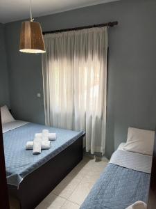 Postel nebo postele na pokoji v ubytování THEODORAS HOUSE