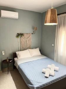 Postel nebo postele na pokoji v ubytování THEODORAS HOUSE