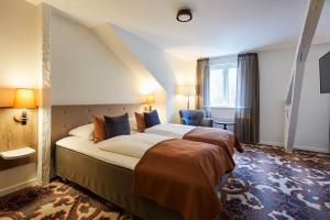 Postel nebo postele na pokoji v ubytování Hotel MDF TELA Near IGI Airport Delhi
