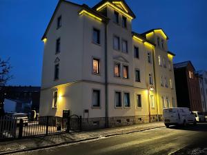 a large white building on the side of a street at Ferienwohnung Helene in Gotha