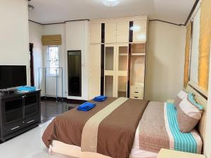 Postel nebo postele na pokoji v ubytování Poolvilla Armthong Home + 16 fotografií