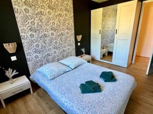 Posteľ alebo postele v izbe v ubytovaní En sol'eau -Appartement à 50 m de la plage