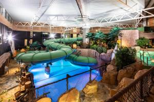 a large indoor water slide in a building at Quality Hotel The Reef in Frederikshavn