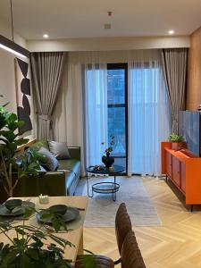 a living room with a couch and a table at Cozy 2BR Natural Light Promo Now in Ðông Khê