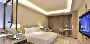 Rúm í herbergi á Xi'an Jinling Purple Mountain Hotel