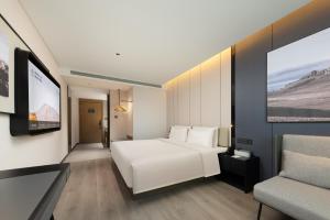 Postel nebo postele na pokoji v ubytování Atour Hotel Guangzhou Baiyun Jiahe Hebian