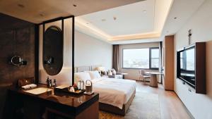 Rúm í herbergi á Xi'an Jinling Purple Mountain Hotel