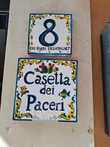 a sign for a pasta restaurant on a wall at La Casetta dei Paceri in Syracuse