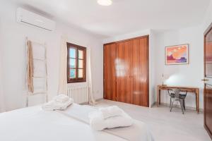 Postel nebo postele na pokoji v ubytování Casa del Puerto
