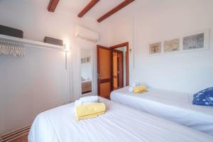 Postel nebo postele na pokoji v ubytování Casa GOLDI by Mallorca Villa Selection