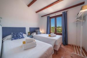 Postel nebo postele na pokoji v ubytování Casa GOLDI by Mallorca Villa Selection