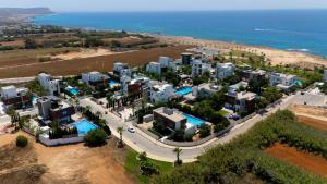 an aerial view of a resort near the ocean at Vivo Mare 3 Bedroom Villas in Ayia Napa