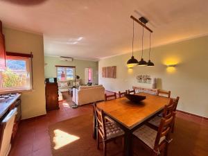 a kitchen and dining room with a table and chairs at New Flat with View over the River Zezere in Casalinho de Santana