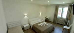 Letto o letti in una camera di AMARE Bed & Breakfast