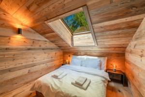 Postel nebo postele na pokoji v ubytování Chalet Plalessu - Latitude Champéry