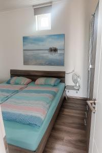 Postel nebo postele na pokoji v ubytování Ferienhaus LouJa