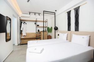 Postel nebo postele na pokoji v ubytování Petra Luxury Suites