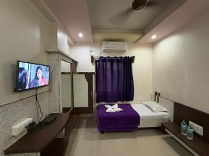 TV a/nebo společenská místnost v ubytování Hotel Temple Sai