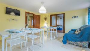 Televízia a/alebo spoločenská miestnosť v ubytovaní Apartamento Pergo Centro Córdoba