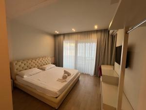 Postel nebo postele na pokoji v ubytování Hotel Ble Ble Vlore