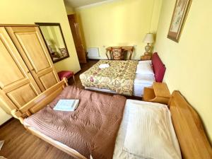 Letto o letti in una camera di Hotel Lileo