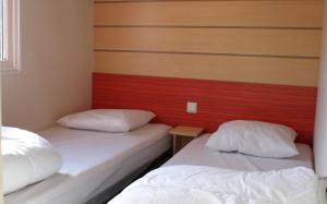 Postel nebo postele na pokoji v ubytování Camping Le Balcon de Chartreuse