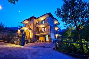 a large house with lights on it at night at Haidi House in Agerola