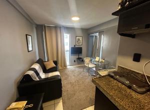 America Flat Localização incrível em São Luís的电视和/或娱乐中心
