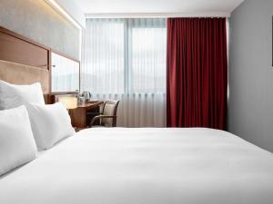 Letto o letti in una camera di Movenpick hotel Sarajevo