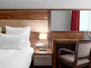Letto o letti in una camera di Movenpick hotel Sarajevo