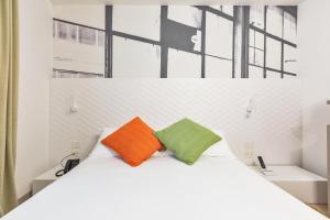Postel nebo postele na pokoji v ubytování Xilhotel by Perle di Puglia