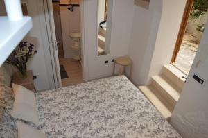 Letto o letti in una camera di G.H.03 Polignano a Mare