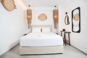 Postel nebo postele na pokoji v ubytování Petra Luxury Suites