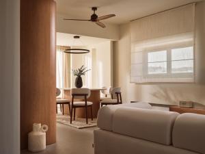 a living room with a couch and a table at Lesante Classic - Preferred Hotels & Resorts in Tsilivi