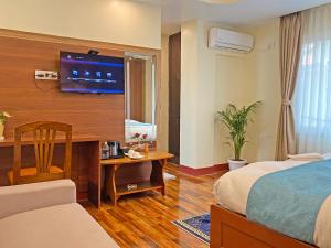 Voodi või voodid majutusasutuse Hotel Himalayan BTS toas
