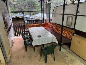 a room with a table and chairs and a couch at medusa gradiste in Ohrid