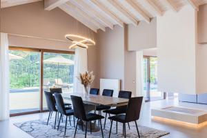 a dining room with a table and chairs at Villa Athina Corfu - 4 bedrooms in Kynopiástai