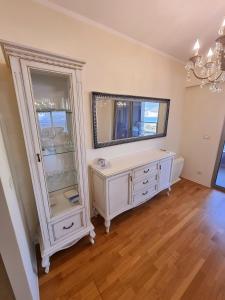 a room with a white cabinet and a mirror at Harmonia Budva 1 in Budva +97 photos