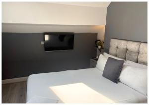 Postel nebo postele na pokoji v ubytování Hotel Anfield