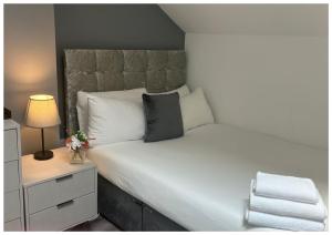 Postel nebo postele na pokoji v ubytování Hotel Anfield