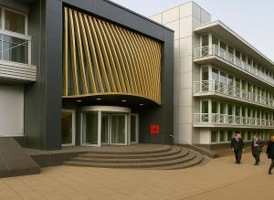 two men in suits walking in front of a building at Modern Flat near Heathrow Airport in Hounslow
