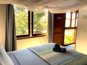 Postel nebo postele na pokoji v ubytování CASA Ecológica Paraty