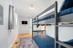 a bedroom with two bunk beds in a room at Platte-River-Play: Lovely 2BDR Barnhouse ➠ 14066 in Beulah