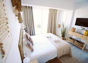 Postel nebo postele na pokoji v ubytování Apartamentos Strand Jávea