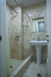 a bathroom with a sink and a shower at New Gudauri Loft 1 in Gudauri