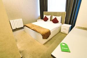 Postel nebo postele na pokoji v ubytování Sunday Boutique Hotel