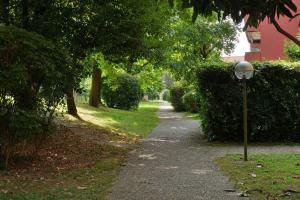 a street light on the side of a sidewalk at BWR - Bilocale a Cornaredo ---vicino Rho Fiera--- in Cornaredo