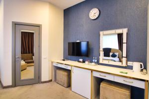 TV a/nebo společenská místnost v ubytování Sunday Boutique Hotel