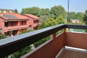 a balcony with a view of some buildings at BWR - Bilocale a Cornaredo ---vicino Rho Fiera--- in Cornaredo