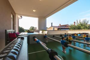 a room with a gym with toy figurines in it at Holiday Home Pula in Pula